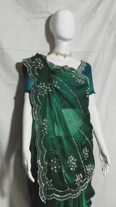 Party wear saree with zarkan and stone embellishments